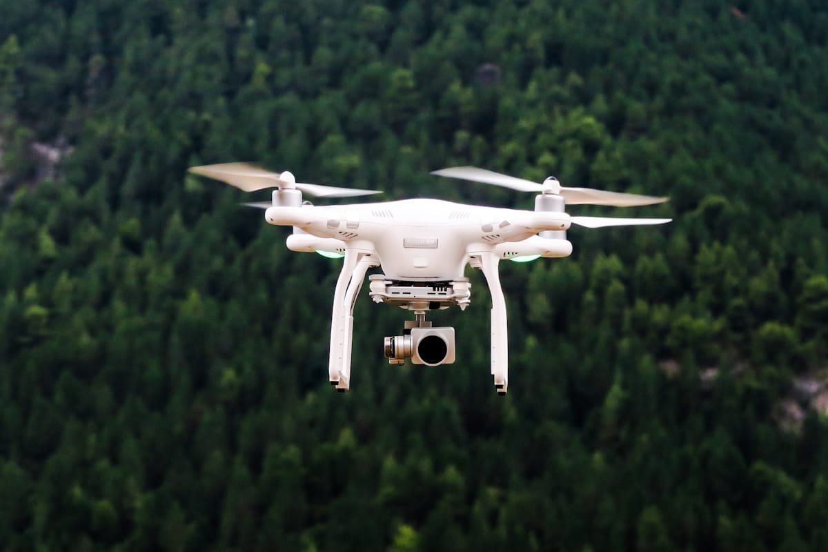 Drone conducting aerial mapping survey over rural Canadian landscape
