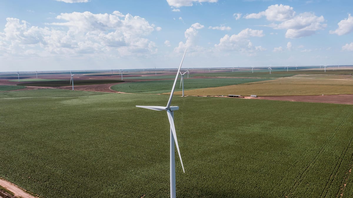 Aerial view of wind turbines spanning green fields in rural Texas, energy infrastructure that could qualify for drone flight restrictions under the proposed FAA rule.