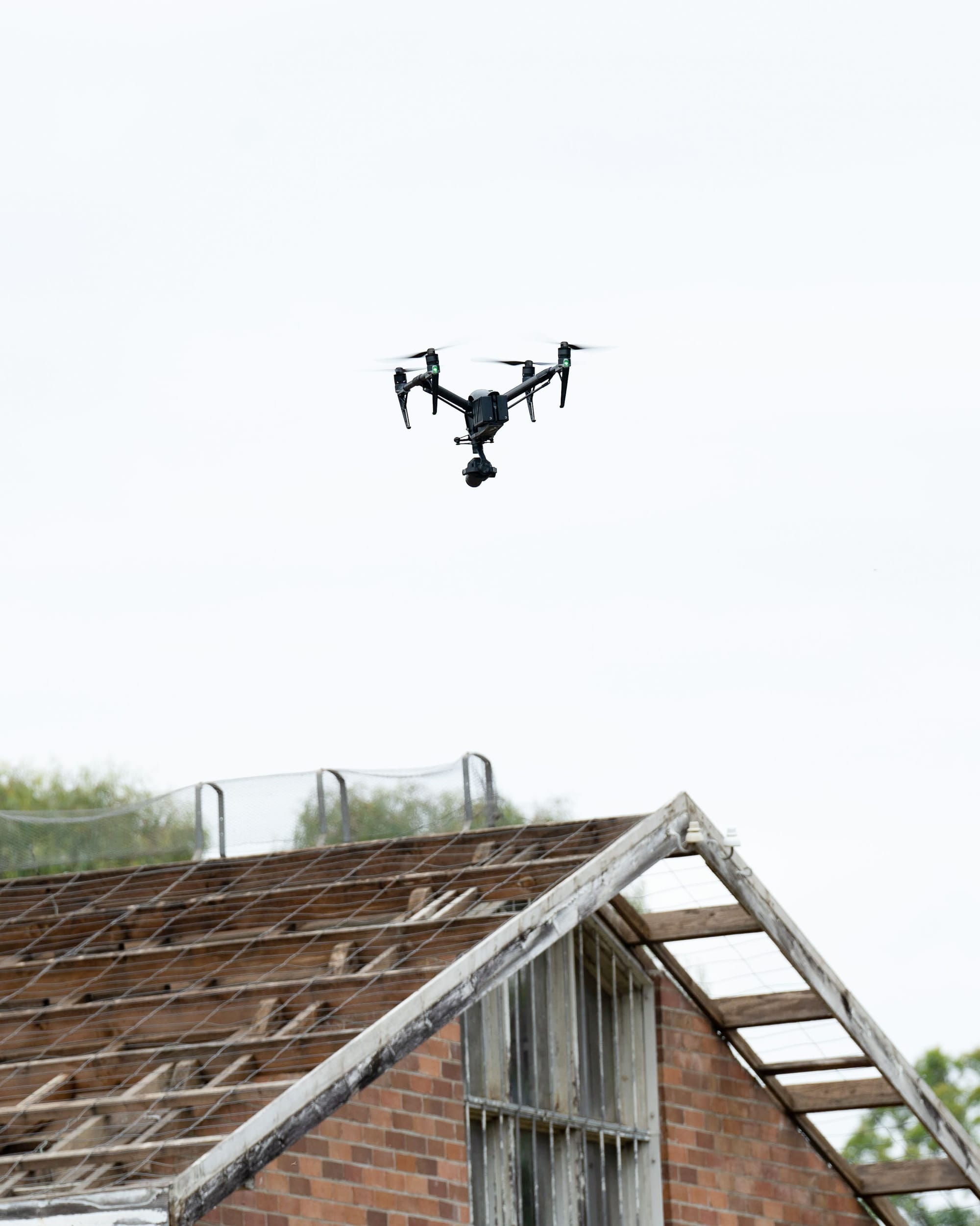 Aerial view of a weathered urban rooftop with distinctive architectural details.