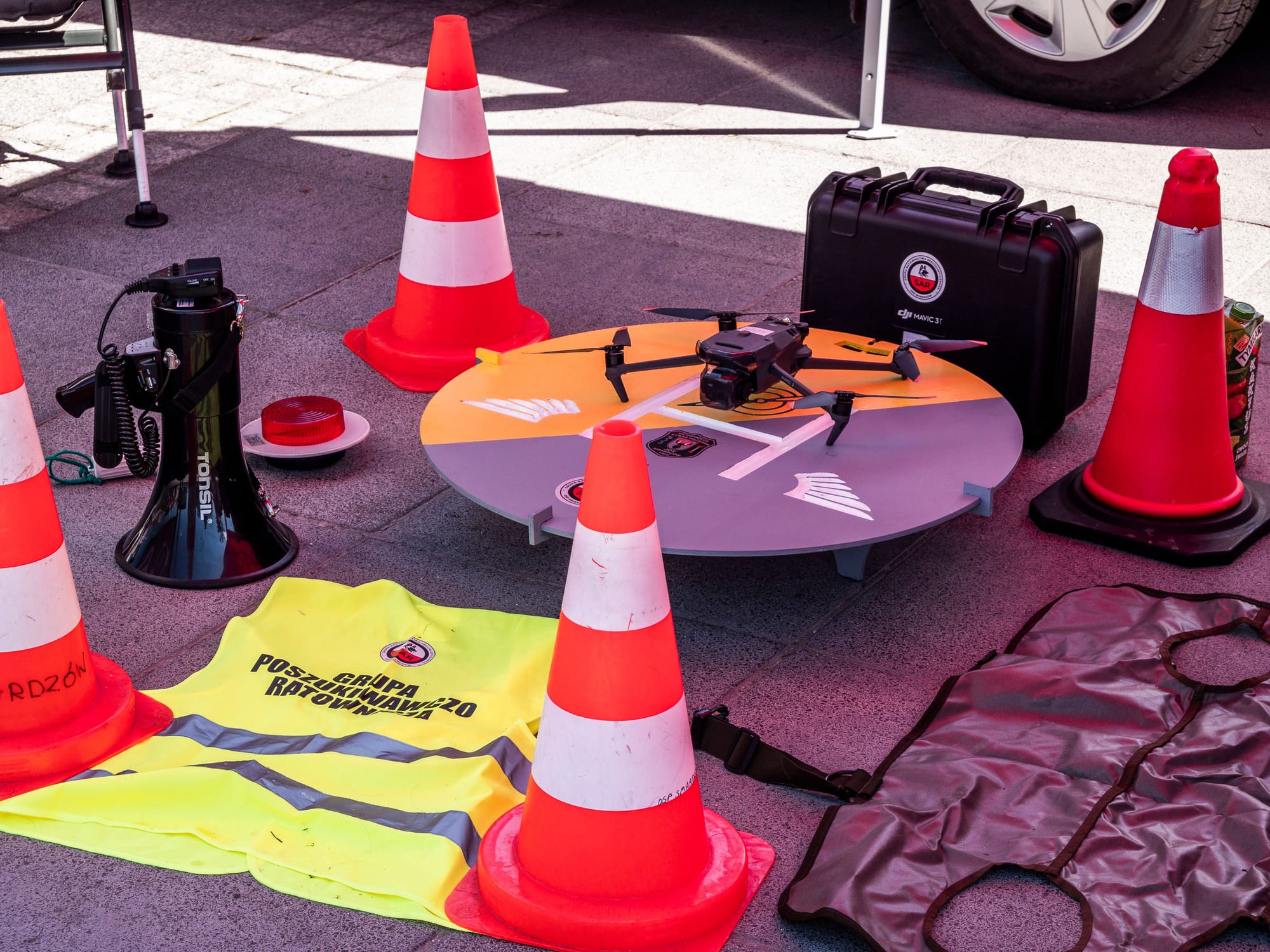 Aerial view of a construction site with workers in safety vests.